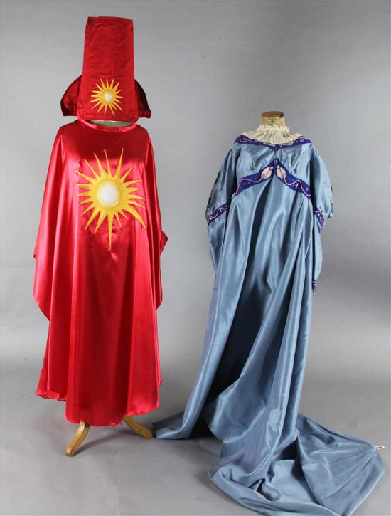 The Magic Flute: Two brightly coloured satin appliqué cloaks, a blue appliqué dress, two leather jackets,